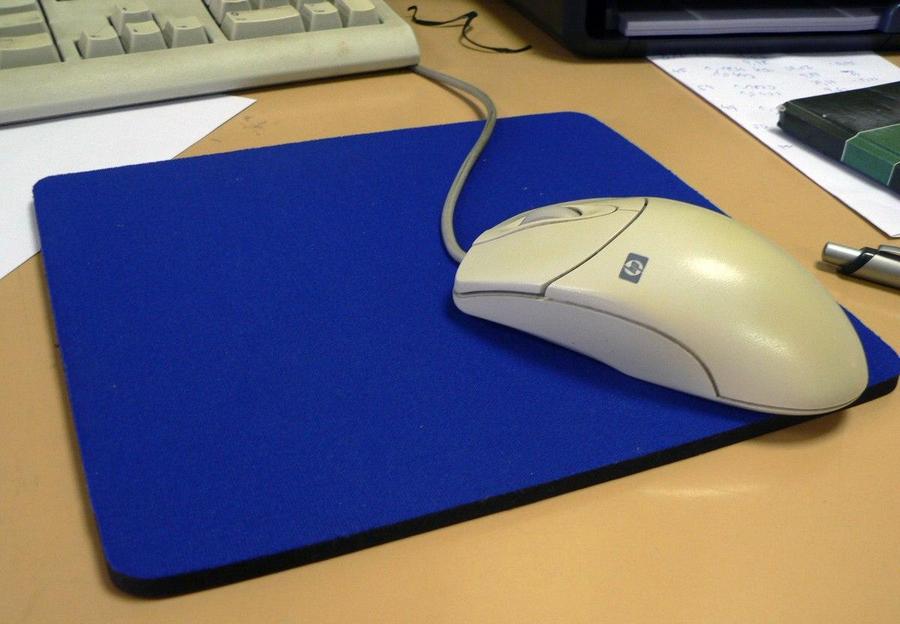 older ball mouse on a mousepad