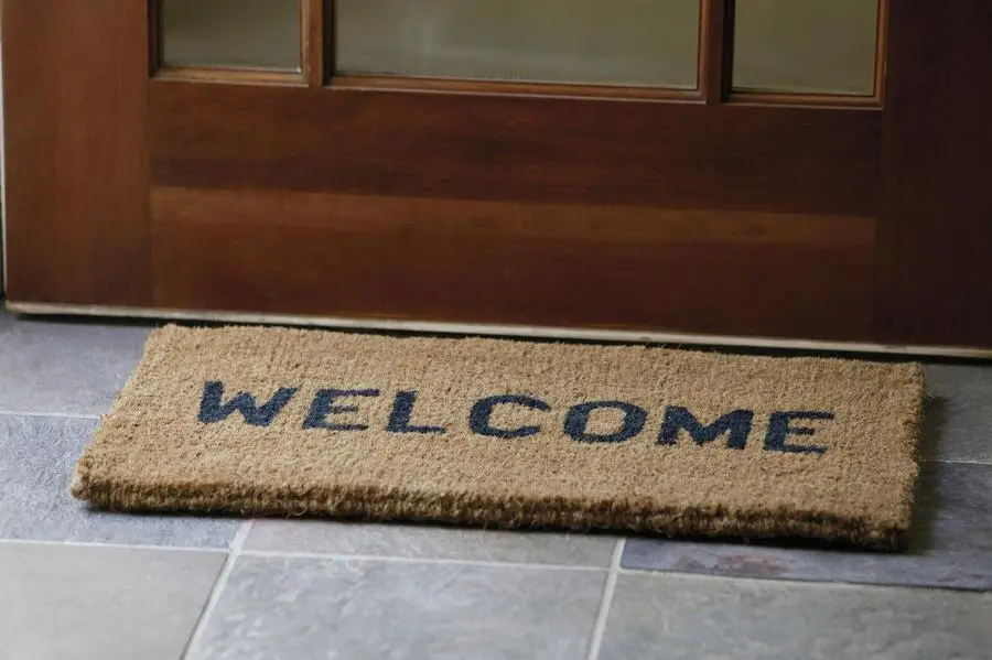 Welcome mat in front of door